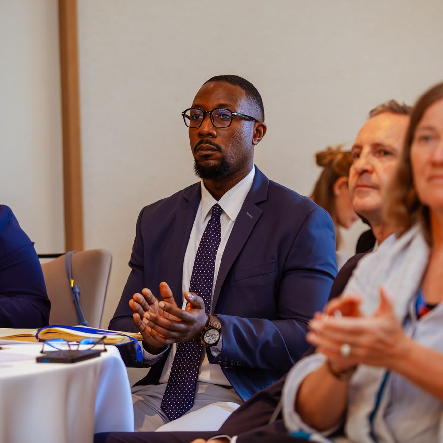 Junior Msangi listening during a forum session
